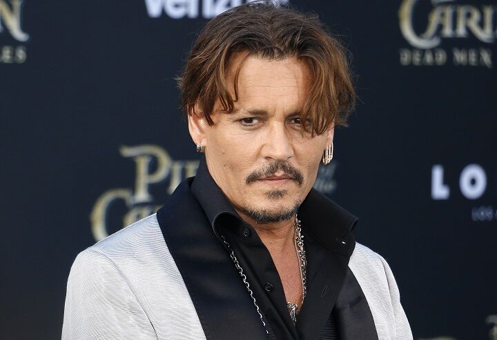 Usual long hair johnny depp in casual to dress down green with khaki brown  pants on Craiyon